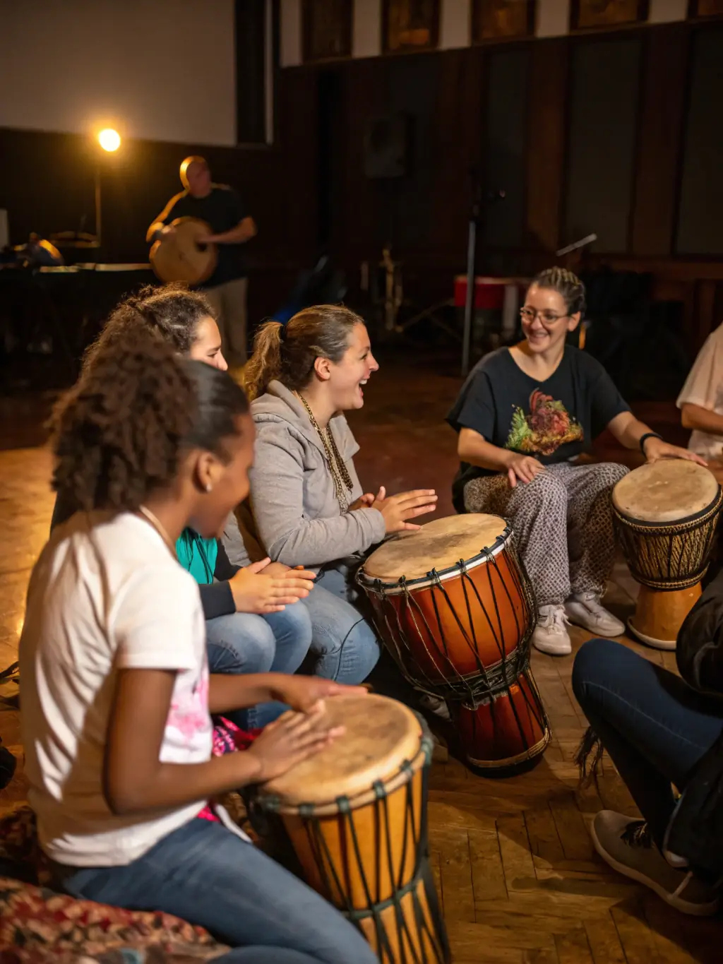 A dynamic image of a musical workshop led by LE CRI DE LA DIESE, featuring participants of various ages actively engaged in singing and playing instruments.